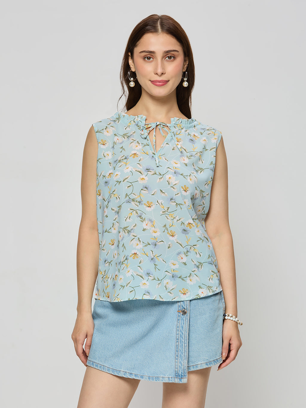 Georgette ruffle top  With ruffle details on the neck line.