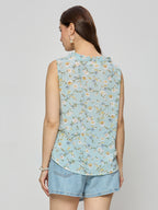 Georgette ruffle top  With ruffle details on the neck line.