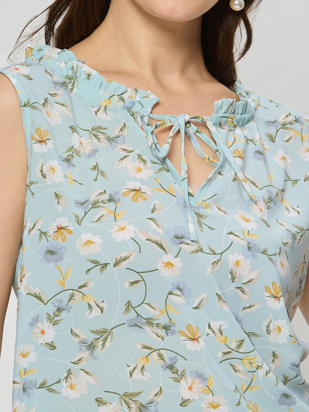 Georgette ruffle top  With ruffle details on the neck line.